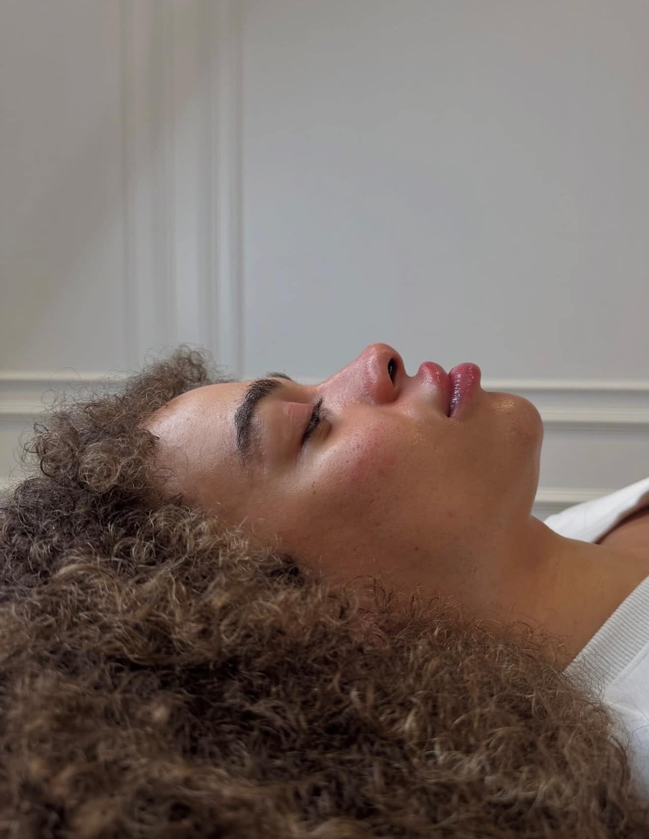 A calm client during a treatment at Face by Demi